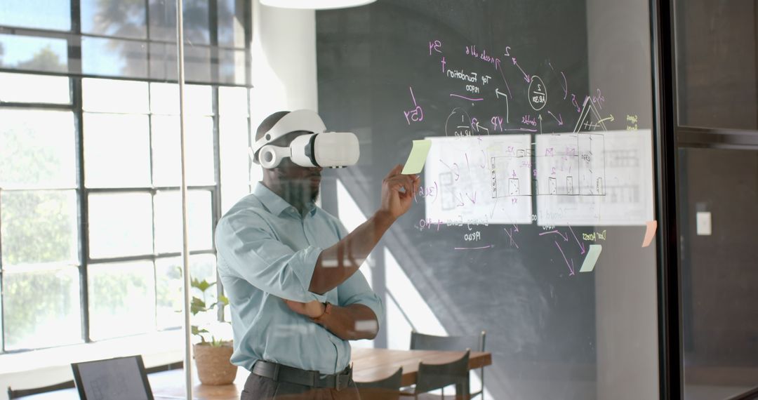 Businessman with VR Headset Analyzing Data in Modern Office