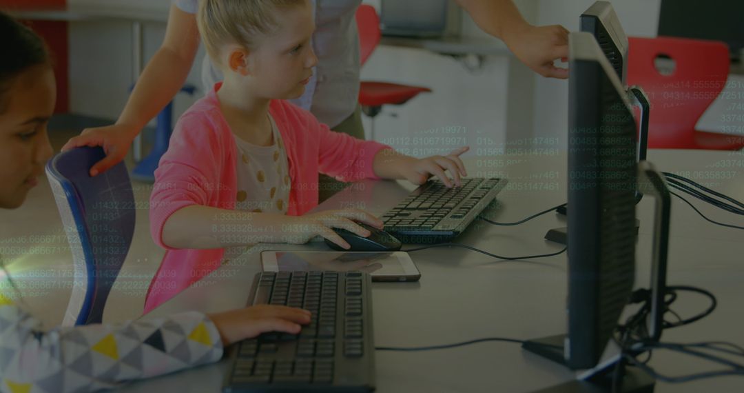 Schoolchildren Learning Computer Skills with Teacher Assistance