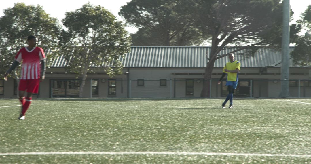 Soccer Players Practicing on Field Displaying Teamwork and Skill