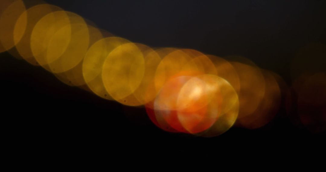 Blurred Festive Bokeh Lights Against Dark Background