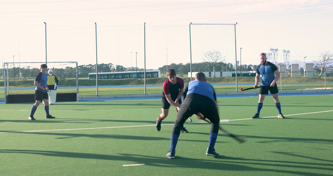 Diverse Field Hockey Team Competing on Synthetic Turf
