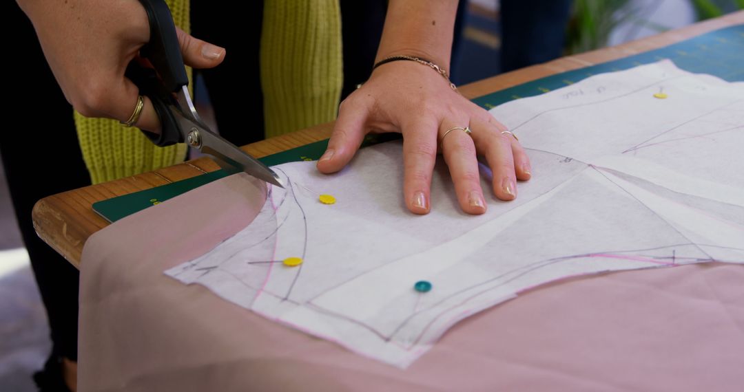 Person Cutting Fabric with Scissors in Workshop Setting - Free Images, Stock Photos and Pictures on Pikwizard.com