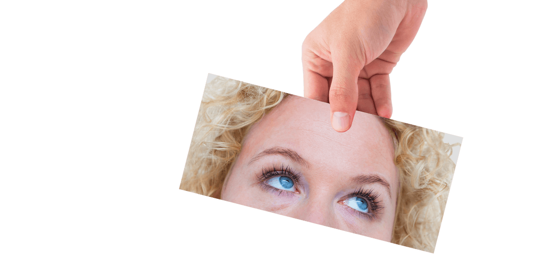 Transparent Hand Holding Photo of Woman's Eyes