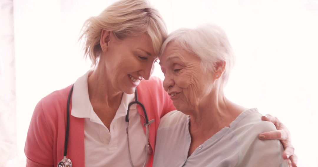 Nurse Embracing Senior Woman with Compassion and Care - Free Images, Stock Photos and Pictures on Pikwizard.com