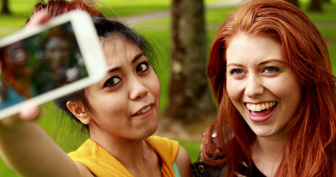 Mixed Ethnicity Friends Taking Selfie Outdoors in Park - Free Images, Stock Photos and Pictures on Pikwizard.com