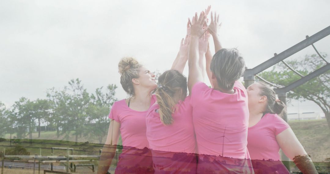 Women Celebrating Teamwork in Outdoor Fitness Session