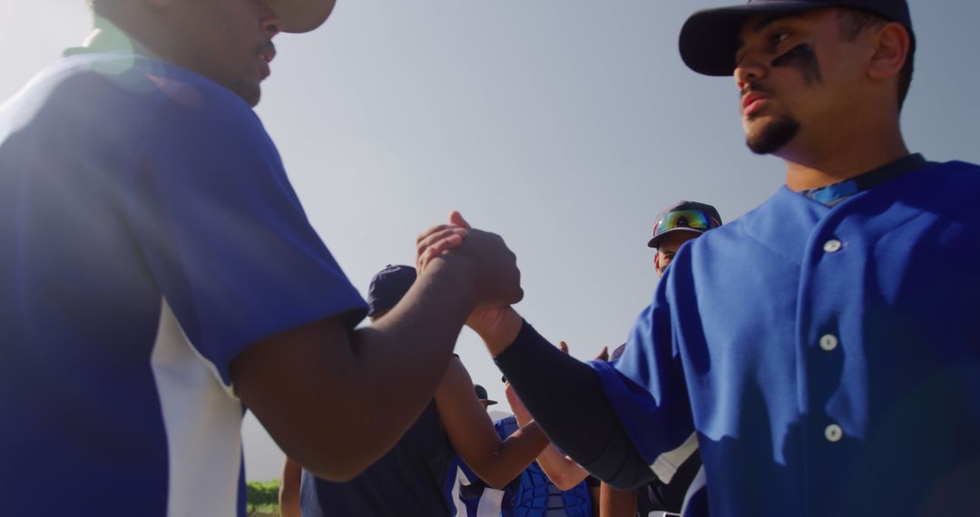 Baseball Players Shaking Hands During Sunny Day after Game - Free Images, Stock Photos and Pictures on Pikwizard.com