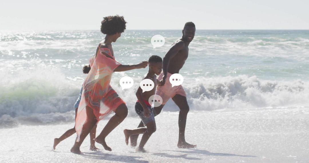 Joyful Family Running on Sunlit Beach Shoreline
