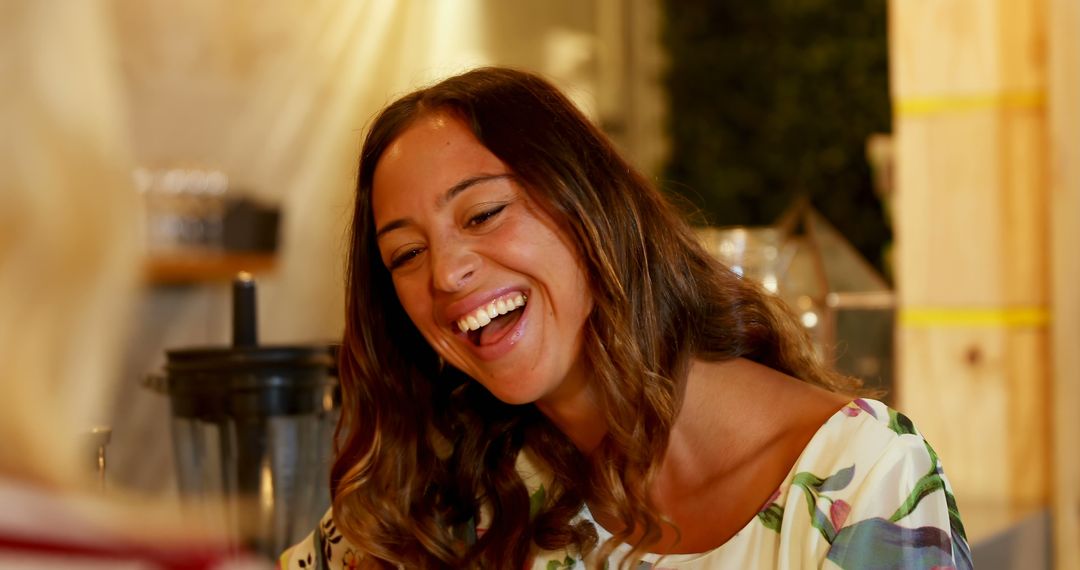 Cheerful Woman Laughing in a Cafe - Free Images, Stock Photos and Pictures on Pikwizard.com