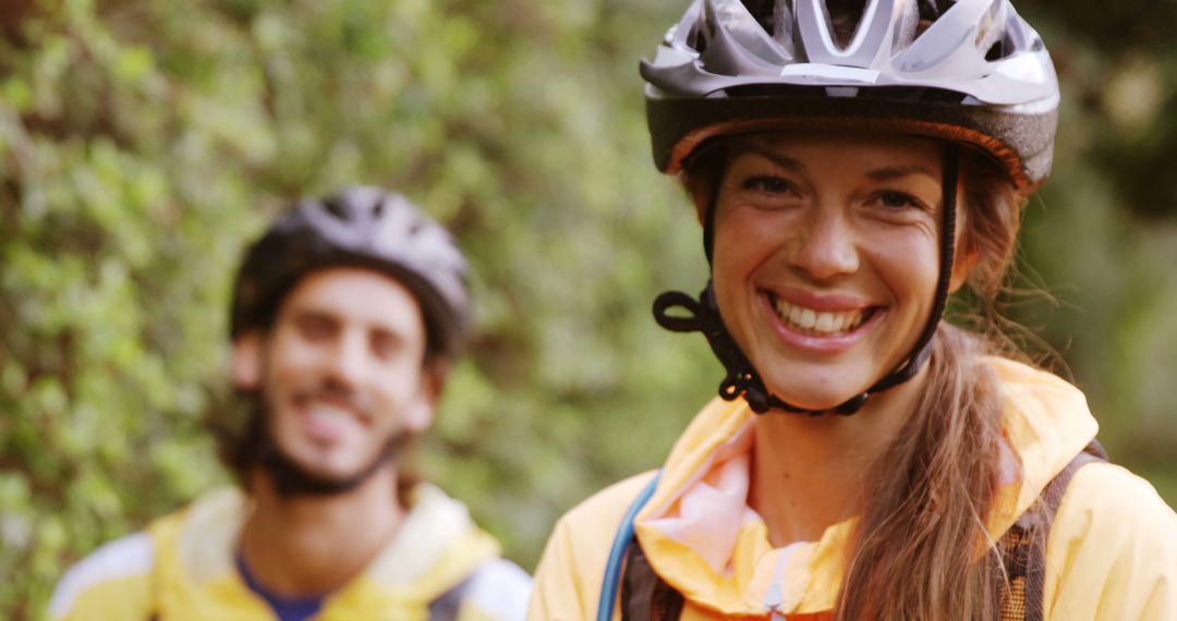 Smiling Cyclists on Nature Trail Taking Break with Bike Helmets