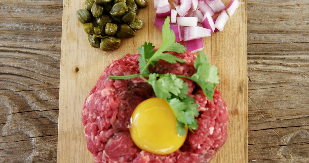 Steak Tartare Ingredients on Wooden Board Top View