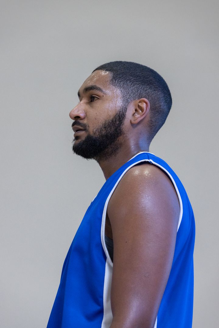 Determined Athlete Pausing in Gym for Motivation Break