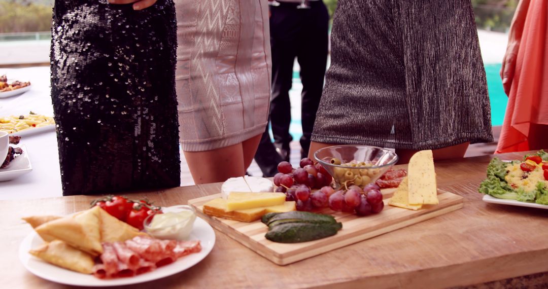 Group of Women Enjoying Appetizers at Outdoor Event - Free Images, Stock Photos and Pictures on Pikwizard.com