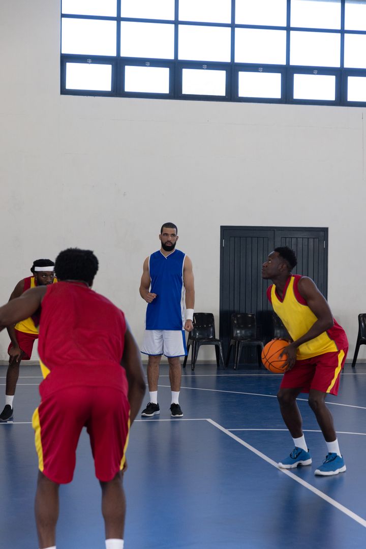 Focused Player Shooting Free Throw Under Intense Coaching