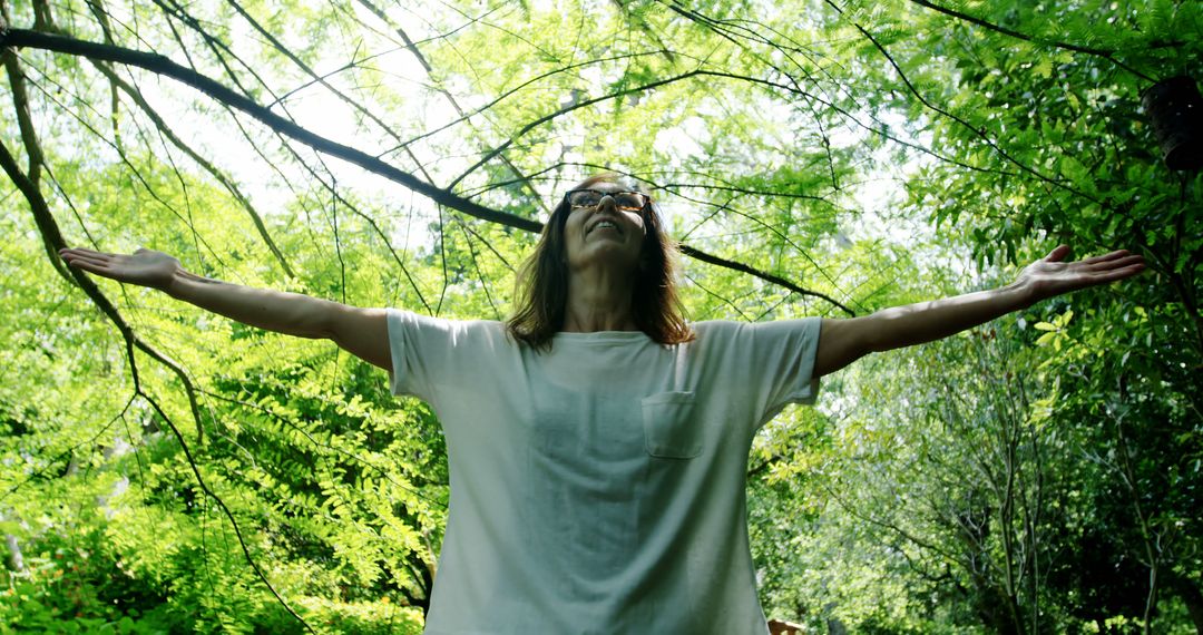 Joyful Person Embracing Nature with Spread Arms - Free Images, Stock Photos and Pictures on Pikwizard.com