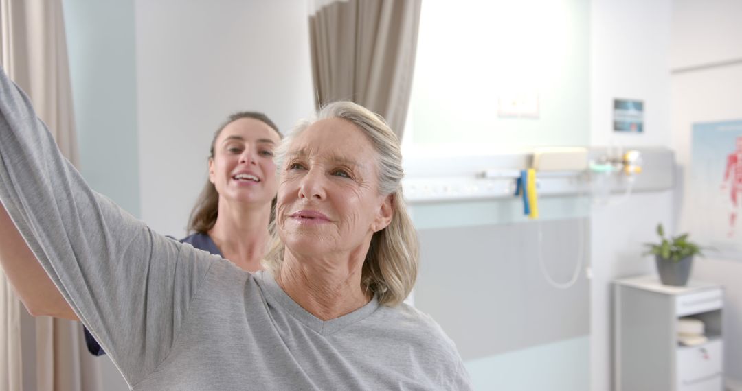 Female Physiotherapist Assisting Senior Woman with Arm Exercise - Free Images, Stock Photos and Pictures on Pikwizard.com