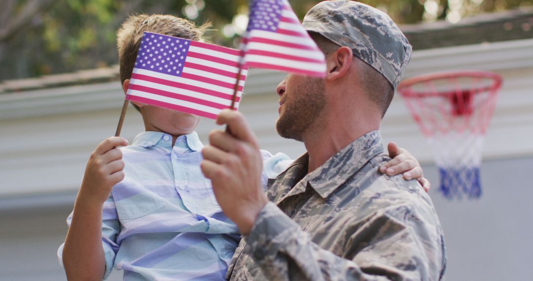 Military Father Reuniting with Son Holding American Flags - Free Images, Stock Photos and Pictures on Pikwizard.com