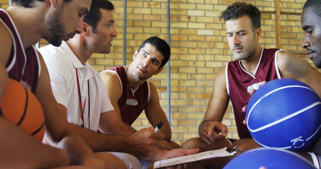 Basketball Coach Giving Strategy Talk with Team during Time-Out - Free Images, Stock Photos and Pictures on Pikwizard.com