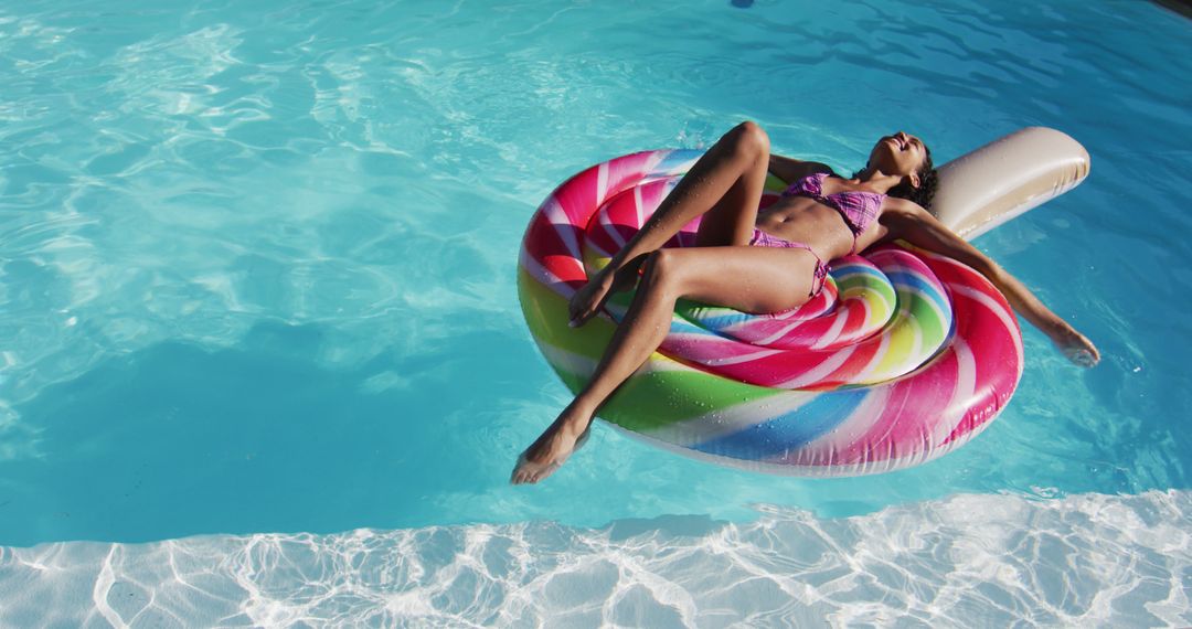 Woman Relaxing on Colorful Pool Float in Clear Blue Water - Free Images, Stock Photos and Pictures on Pikwizard.com