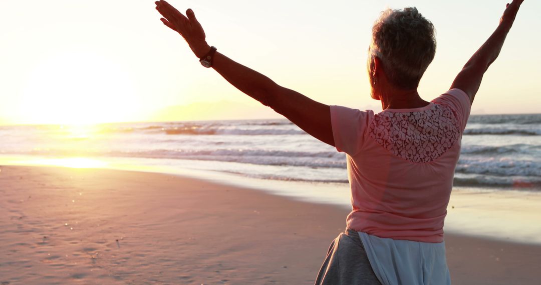 Senior Woman Enjoying Sunset on Beach - Free Images, Stock Photos and Pictures on Pikwizard.com