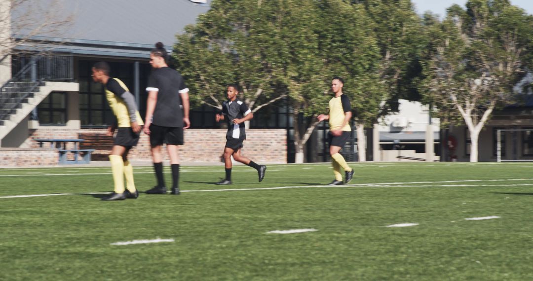Soccer Team Practicing Focusing on Teamwork and Strategy Outdoors