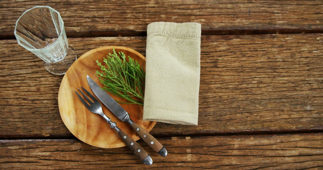 Rustic Table Setting with Cutlery and Herb Accent - Free Images, Stock Photos and Pictures on Pikwizard.com