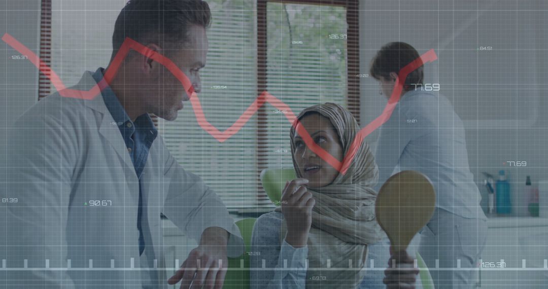 Dentist consulting headscarf patient with financial data overlay