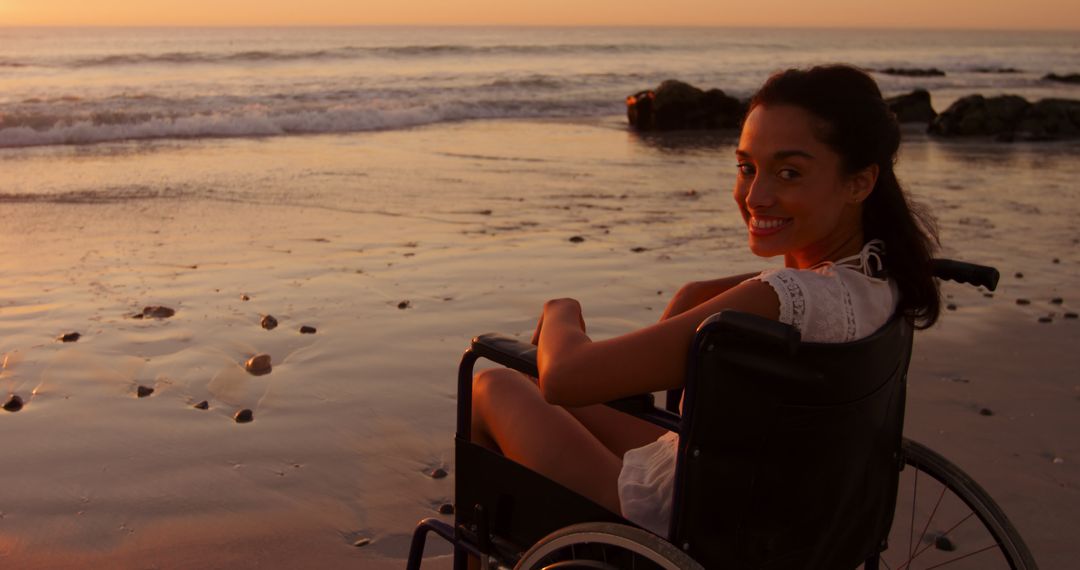 Woman in Wheelchair Enjoying Serene Beach Sunset - Free Images, Stock Photos and Pictures on Pikwizard.com