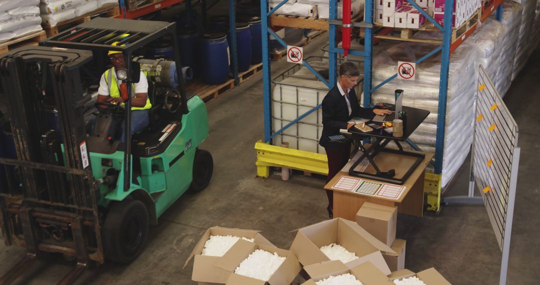 Warehouse Workers Operating Forklift and Managing Inventory - Free Images, Stock Photos and Pictures on Pikwizard.com