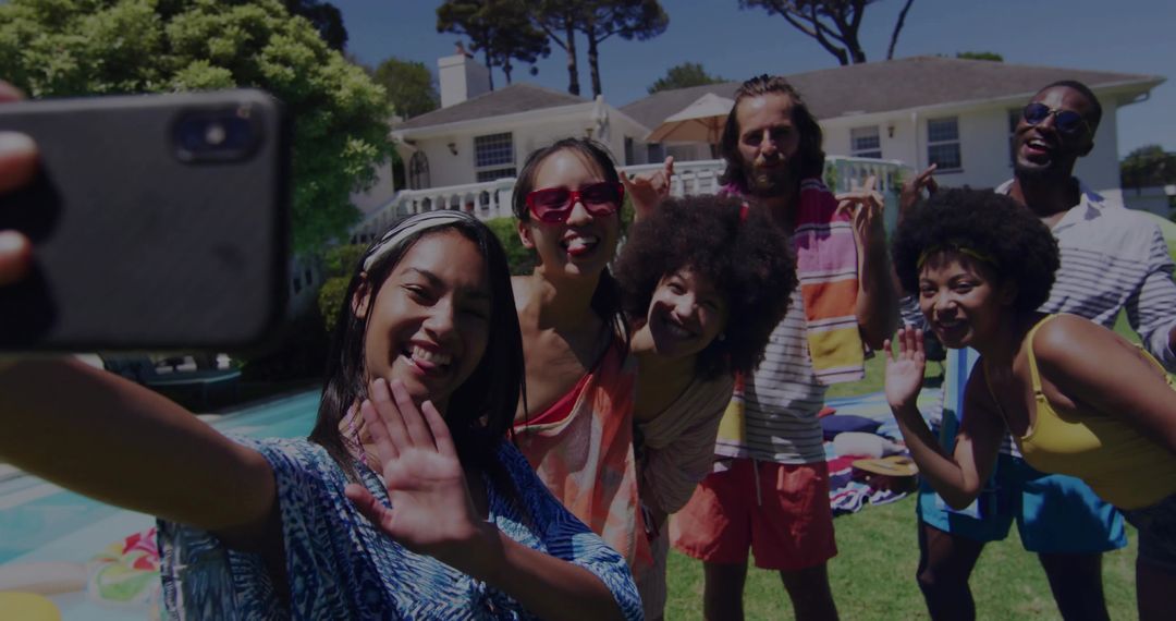 Friends Enjoying Summer Afternoon and Taking Selfie By Poolside Celebrating Vacation