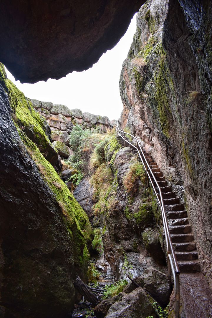 Narrow Rocky Passage with Mossy Staircase Leading Upward - Free Images, Stock Photos and Pictures on Pikwizard.com