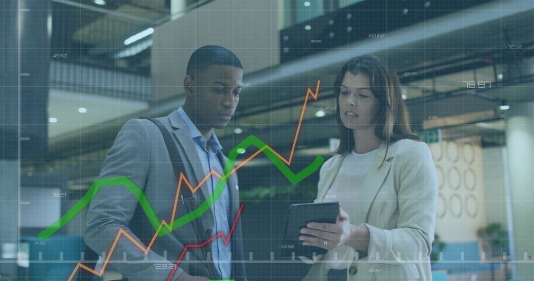 Business Professionals Analyzing Market Data on Tablet