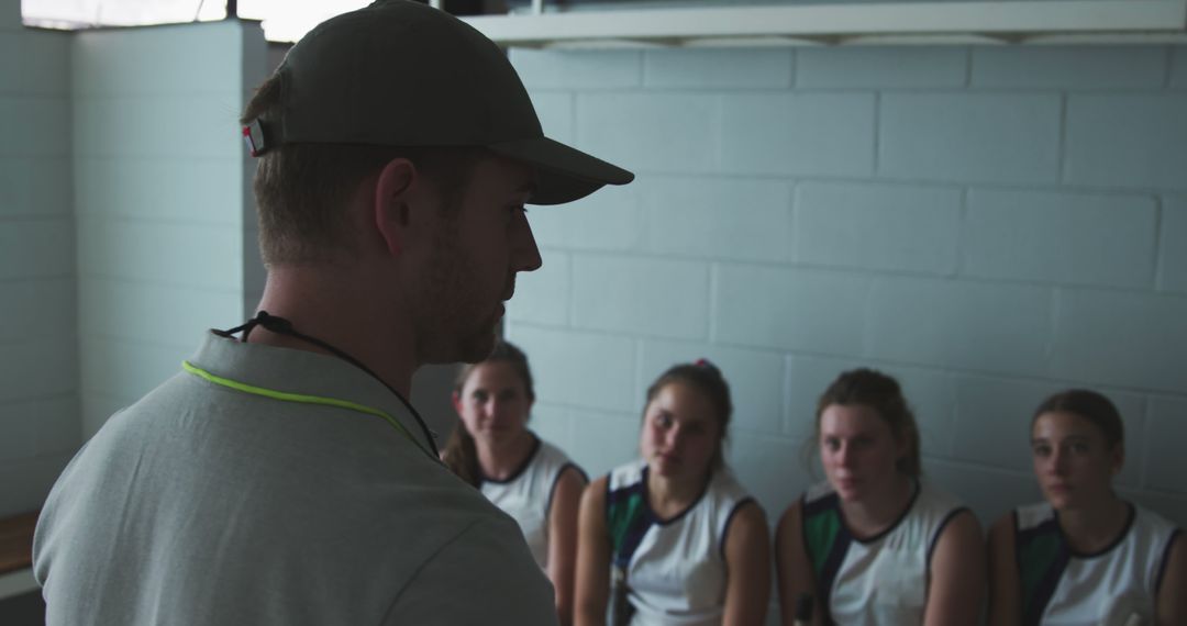 Coach Giving Speech to Young Female Basketball Team in Locker Room - Free Images, Stock Photos and Pictures on Pikwizard.com