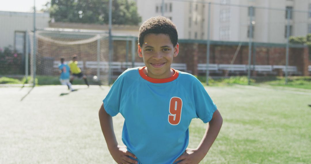 Smiling Young Soccer Player on Outdoor Field - Free Images, Stock Photos and Pictures on Pikwizard.com