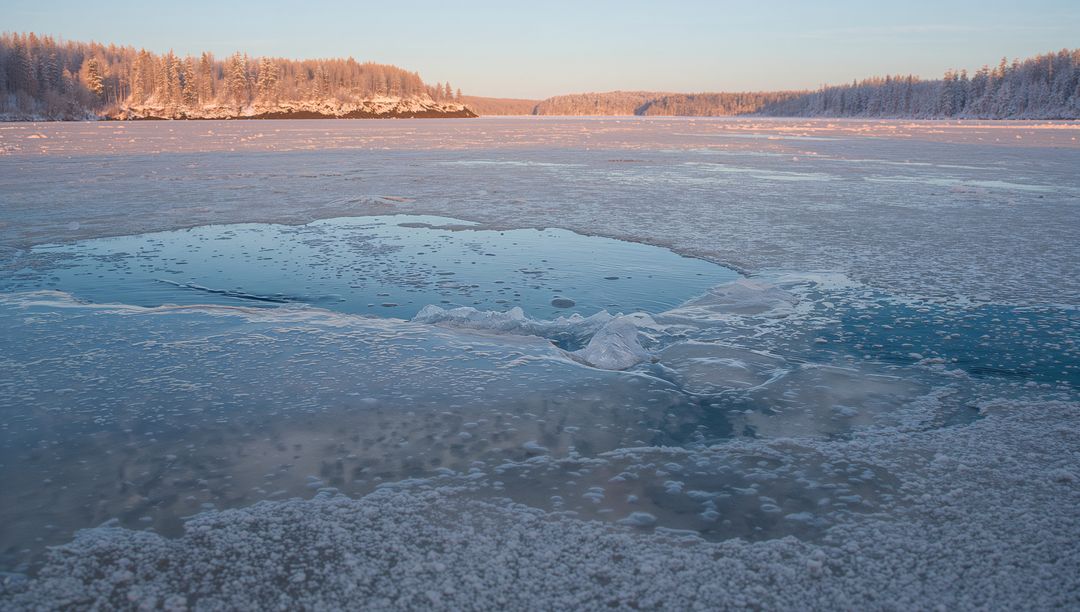 Reflection on Frozen Winter Lake with Open Water Patch