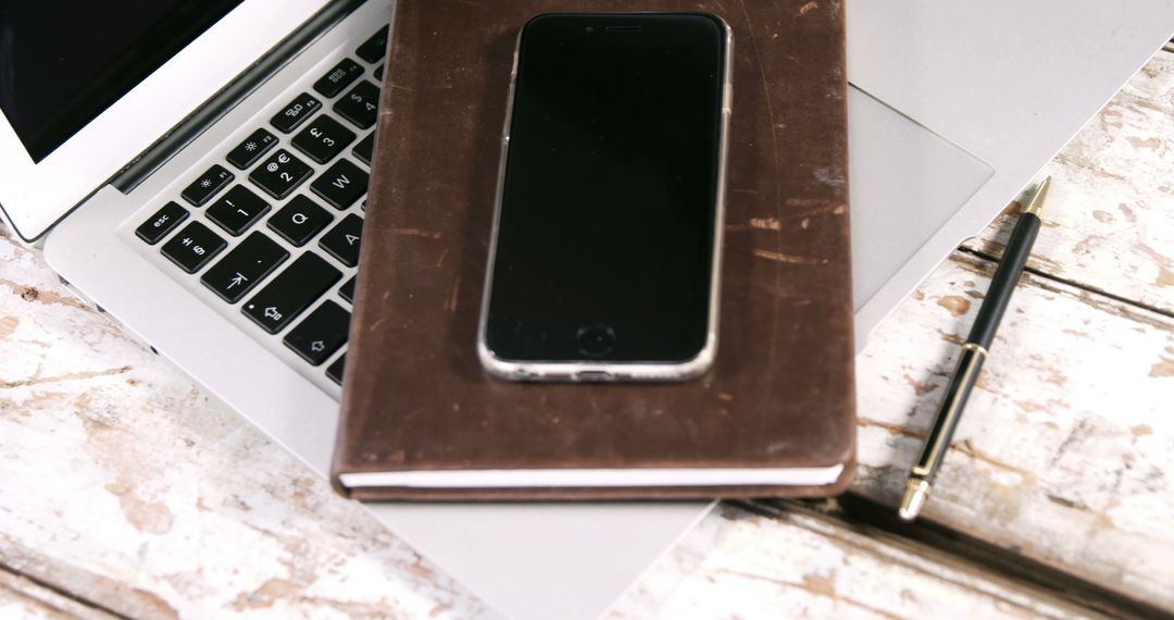 Laptop with Smartphone, Notebook and Pen on Rustic Wooden Desk - Free Images, Stock Photos and Pictures on Pikwizard.com