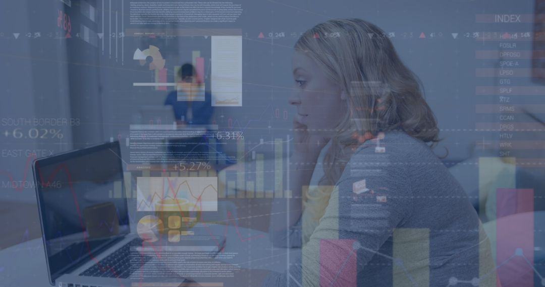 Woman Analyzing Financial Data on Laptop with Digital Interface Overlay