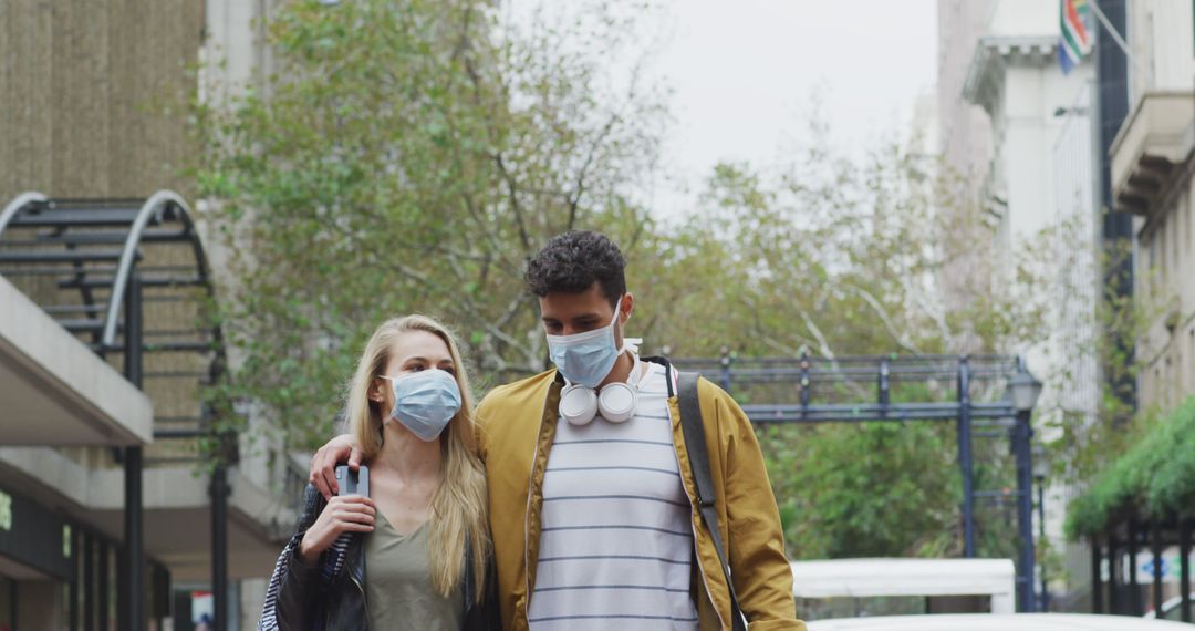 Young Couple Walking in City with Face Masks During Pandemic - Free Images, Stock Photos and Pictures on Pikwizard.com