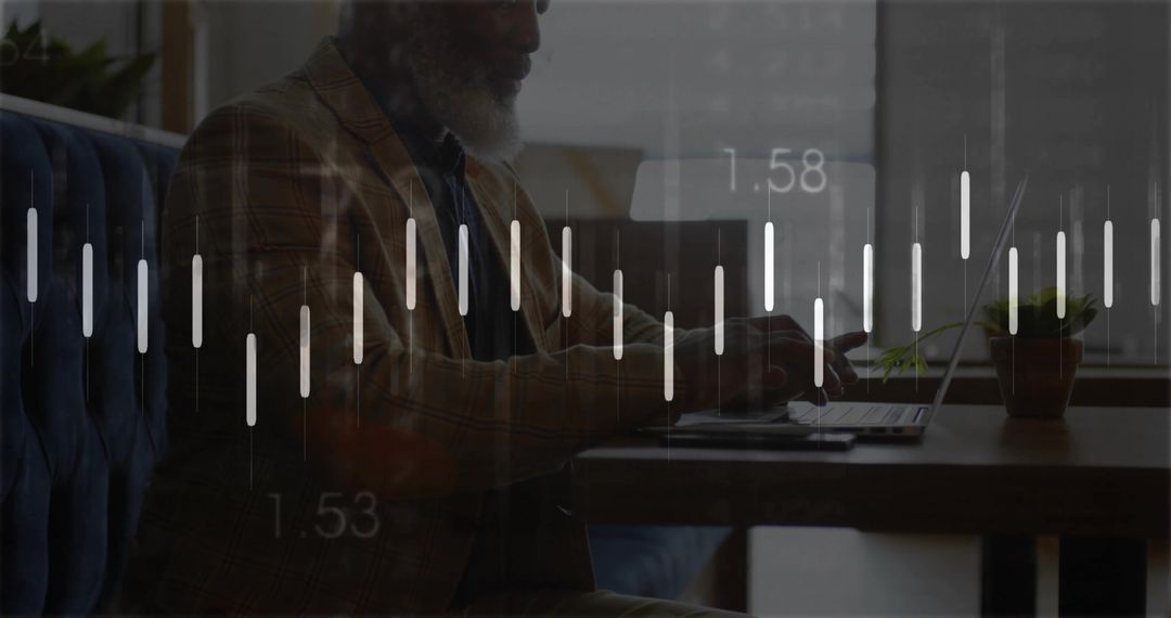 Mature professional typing on laptop in cafe with financial candlestick chart overlay