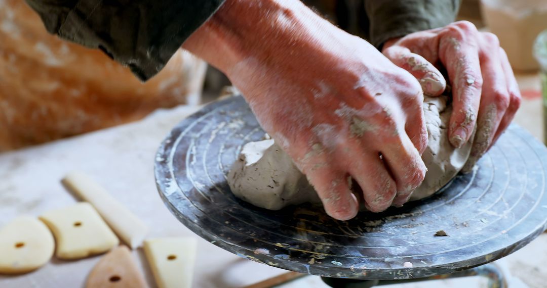 Hands Kneading Clay on Pottery Wheel in Artistic Workshop - Free Images, Stock Photos and Pictures on Pikwizard.com