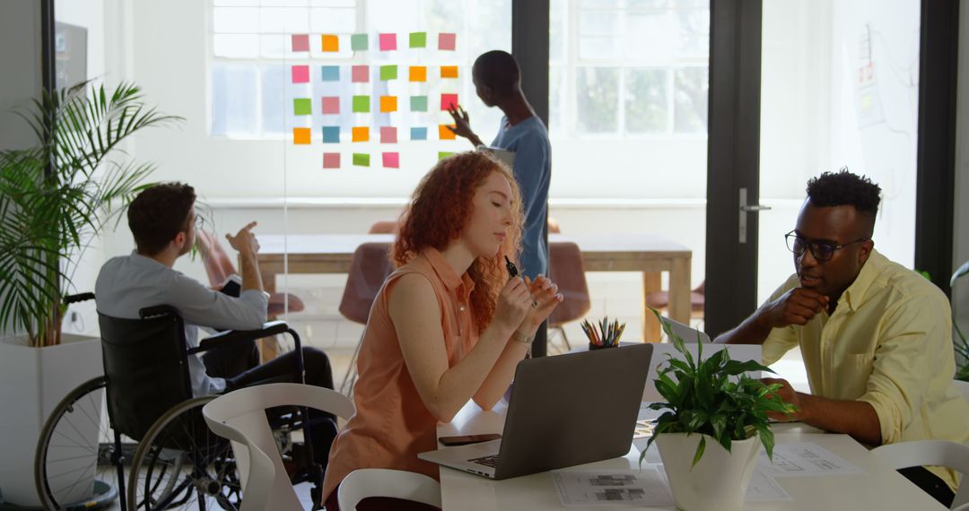 Diverse Office Team Collaborating in Bright Modern Space