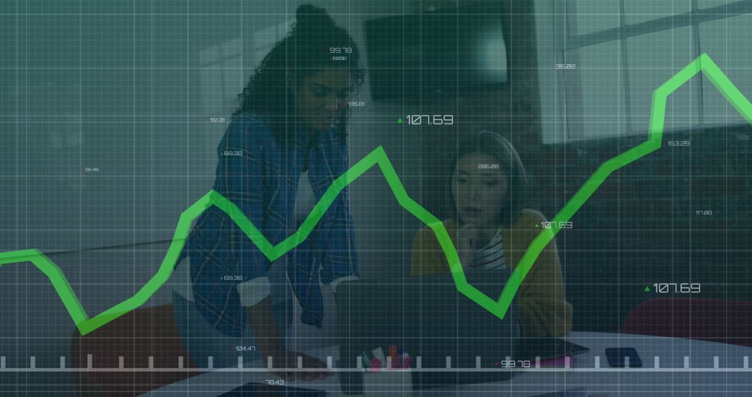 Businesswomen Analyzing Financial Data on Graphs Indoors - Free Images, Stock Photos and Pictures on Pikwizard.com