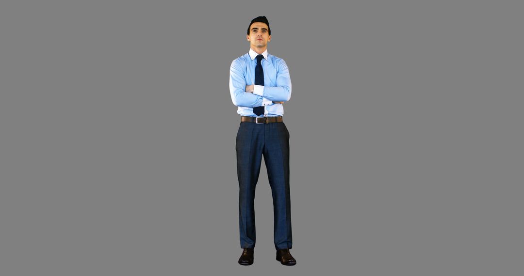 Confident Businessman Standing with Arms Crossed Isolated on Gray Background - Free Images, Stock Photos and Pictures on Pikwizard.com