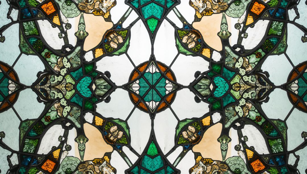 Ornate Stained Glass Filtering Light in Cathedral