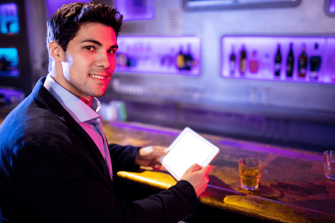 Businessman Opening Tablet in Modern Bar with Transparent Smile