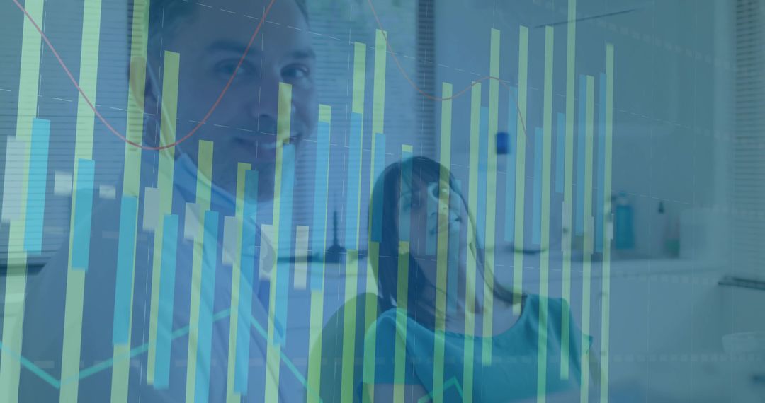 Colleagues Analyzing Financial Data Behind Transparent Screen in Office