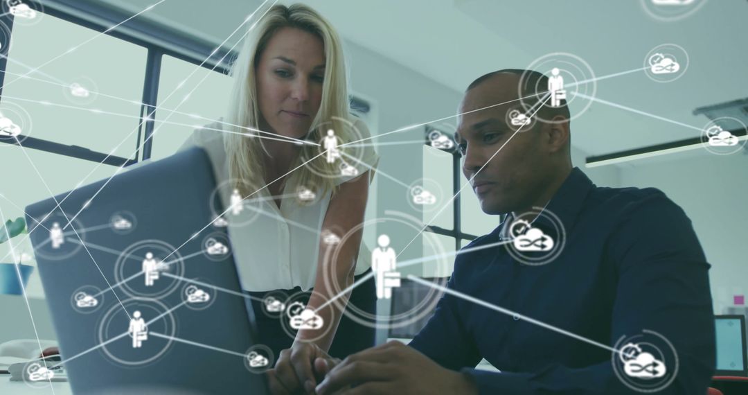 Coworkers Collaborating on Laptop with Digital Network Overlay