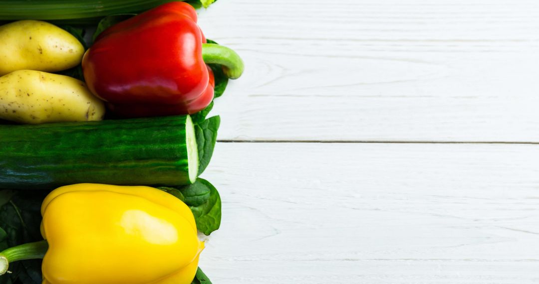 Colorful Fresh Vegetables Arranged on White Wooden Table