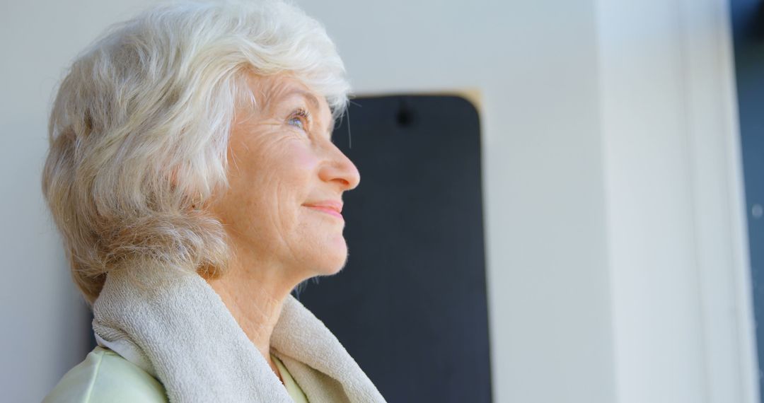 Elderly Woman With Gray Hair Smiling Looking Up - Free Images, Stock Photos and Pictures on Pikwizard.com