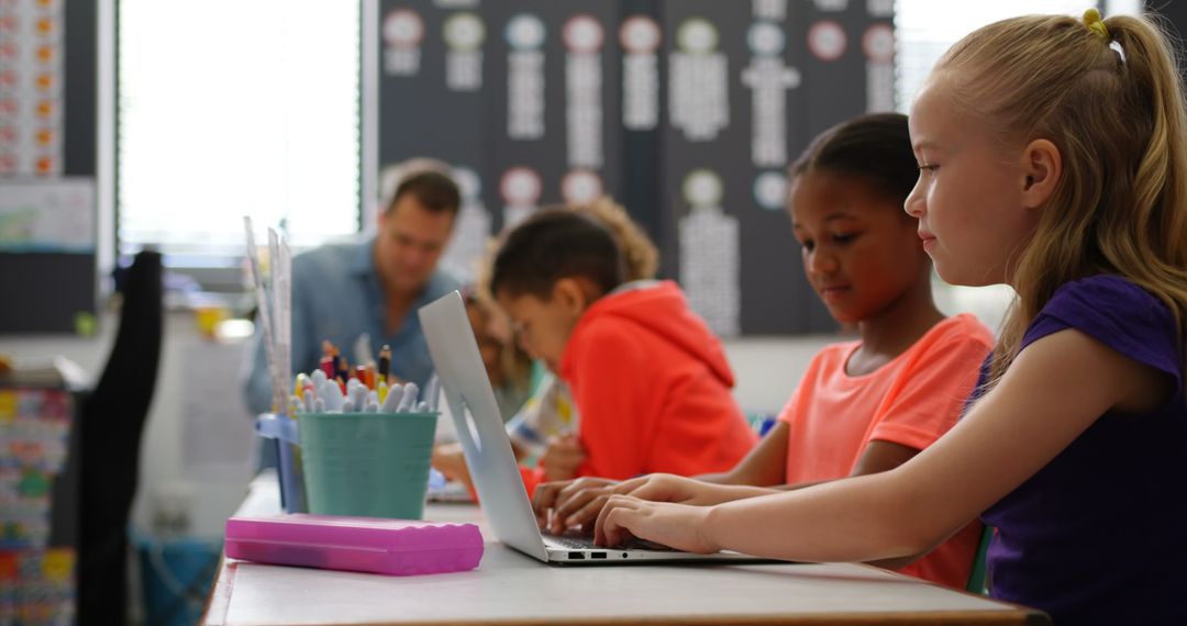 Diverse Classroom with Focused Students on Laptops